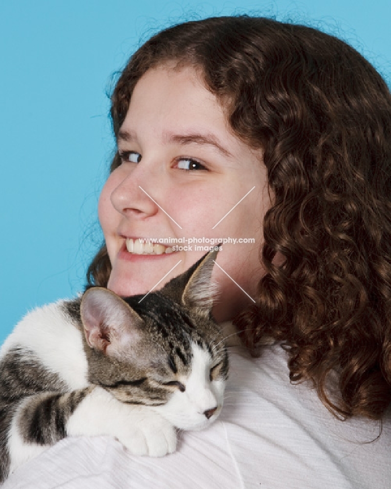 tabby and white cat with girl