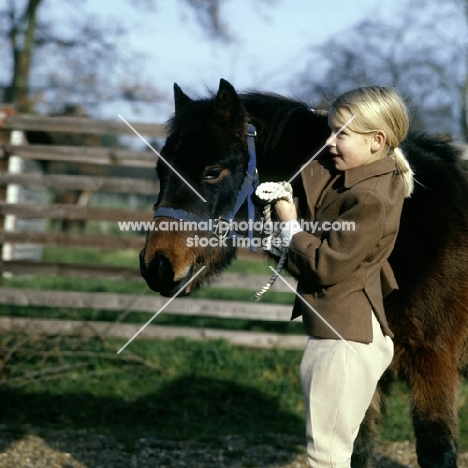 child with her pony