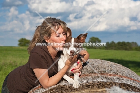 woman kissing her Border Collie