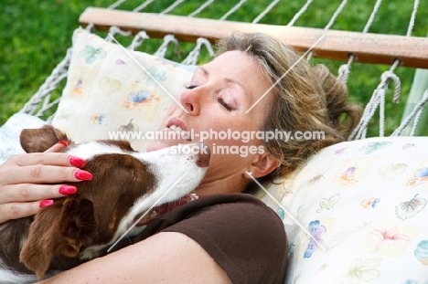 woman cuddling her Border Collie