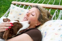 Picture of woman cuddling her Border Collie