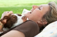 Picture of Woman resting with her Border Collie